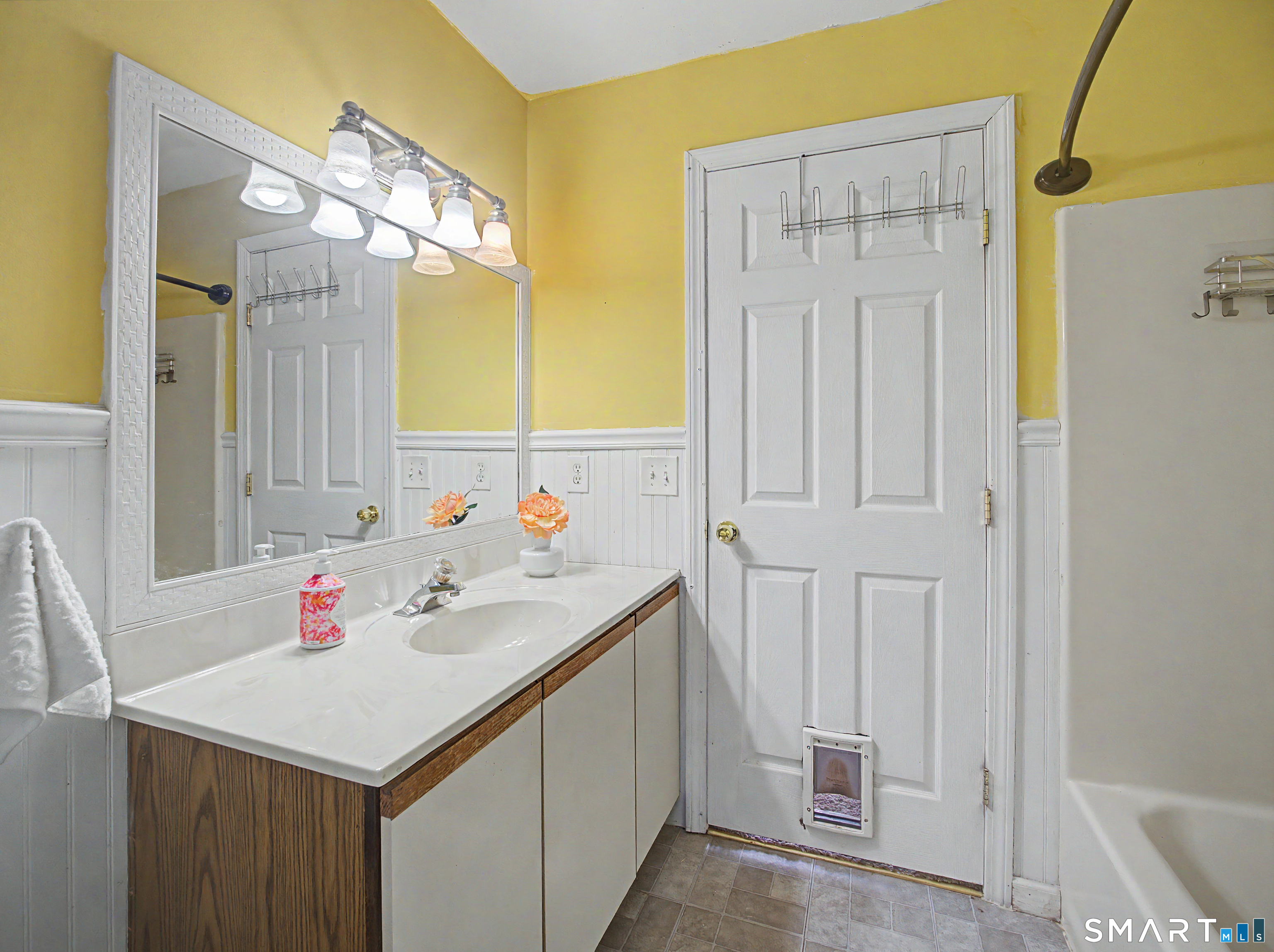 134 Roulin Street Torrington, CT 06790 - Photo 12 of 27 a bathroom with a sink vanity and a mirror