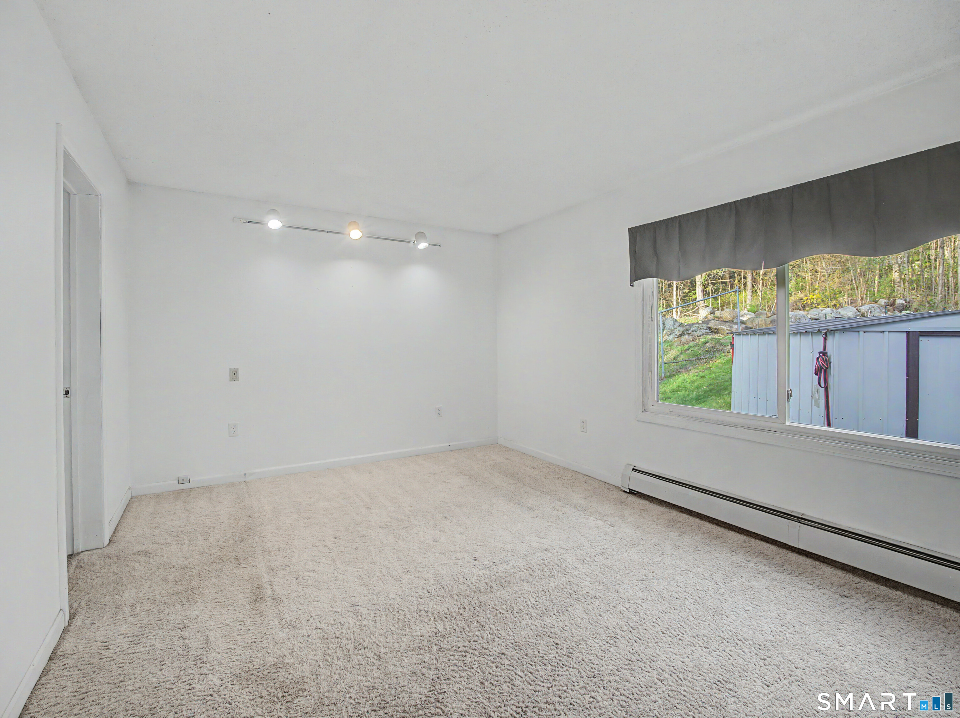 134 Roulin Street Torrington, CT 06790 - Photo 14 of 27 an empty room with a window