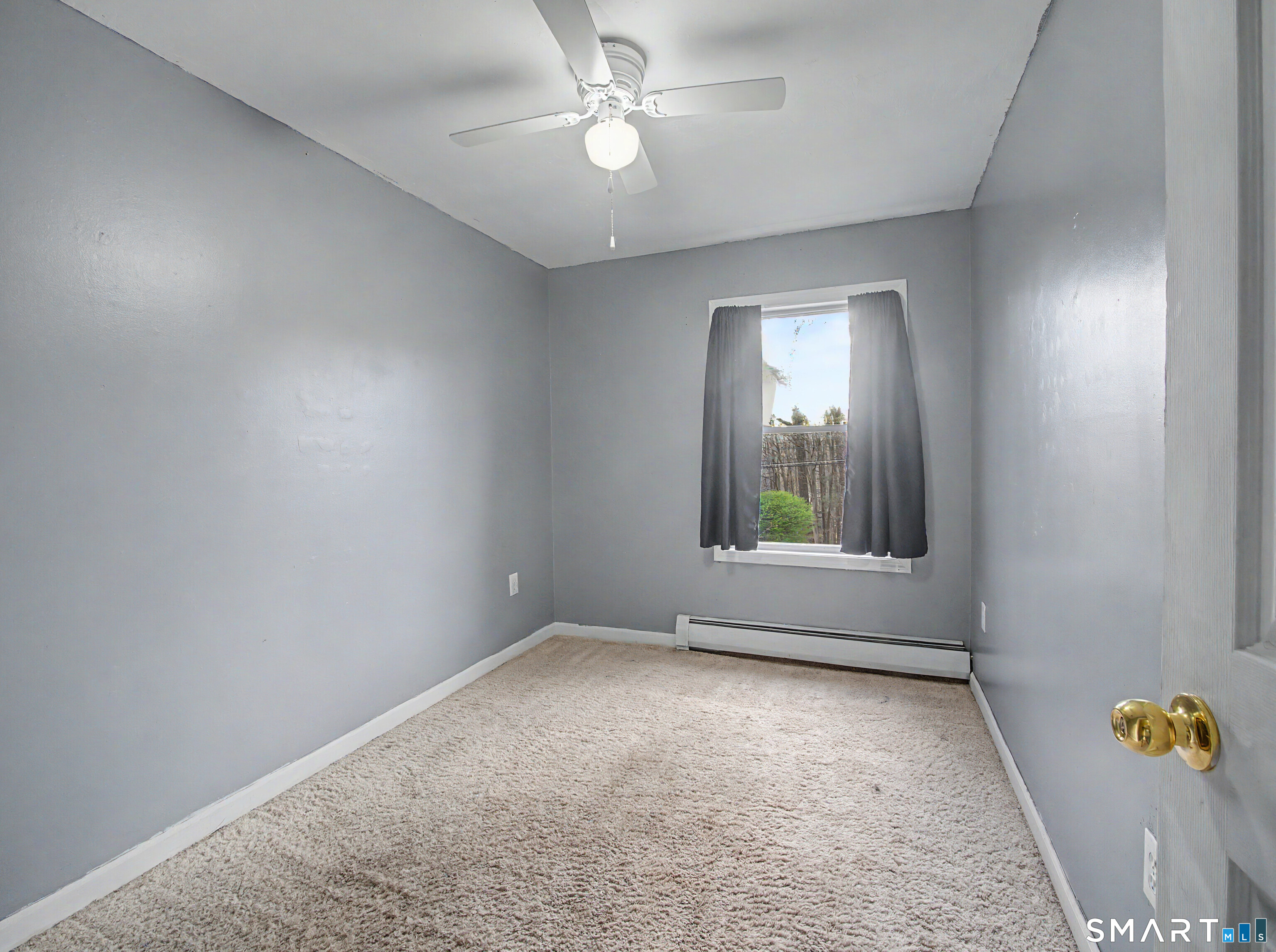 134 Roulin Street Torrington, CT 06790 - Photo 19 of 27 an empty room with a window and ceiling fan