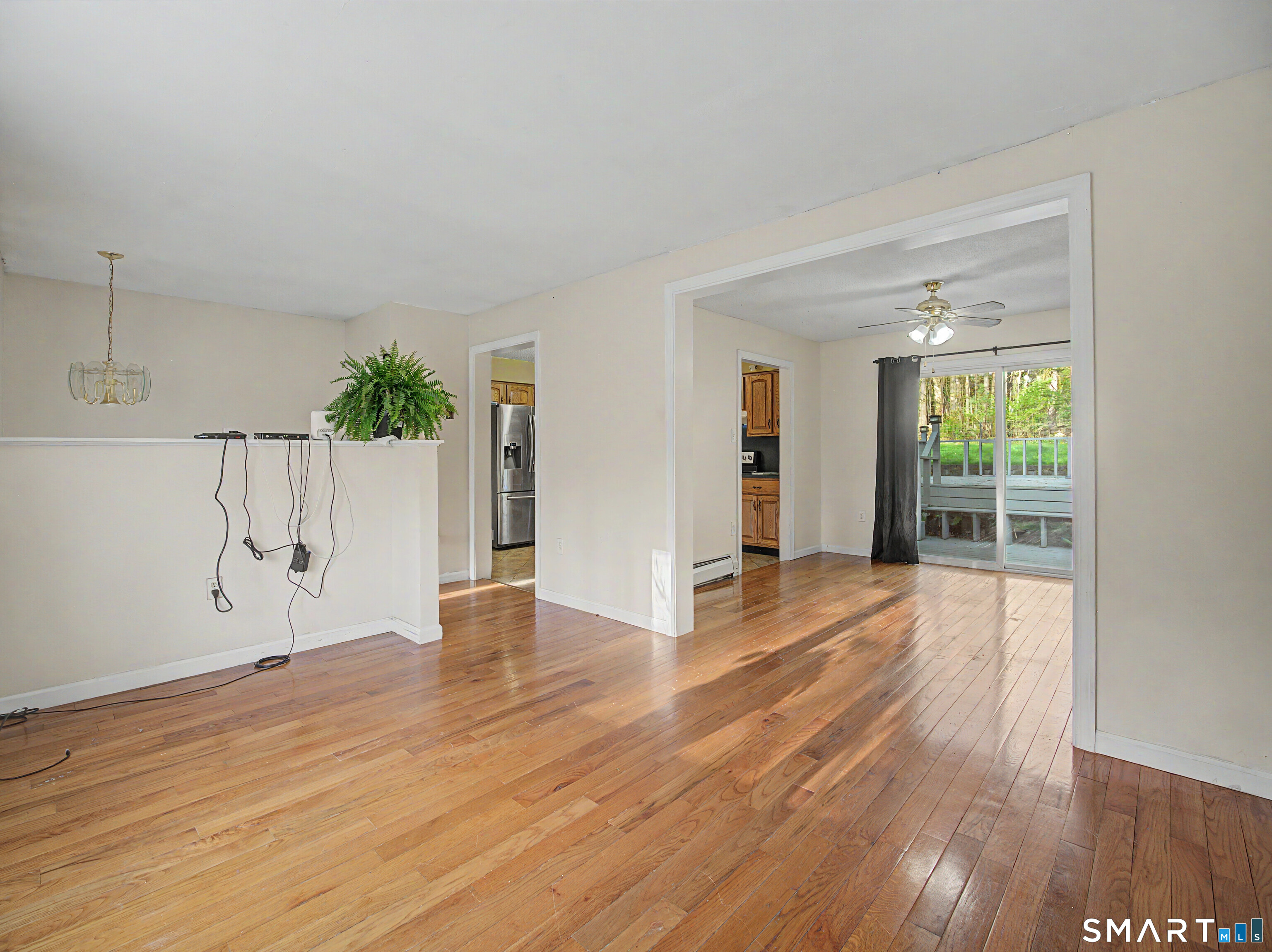 134 Roulin Street Torrington, CT 06790 - Photo 5 of 27 a view of an empty room with wooden floor and a window