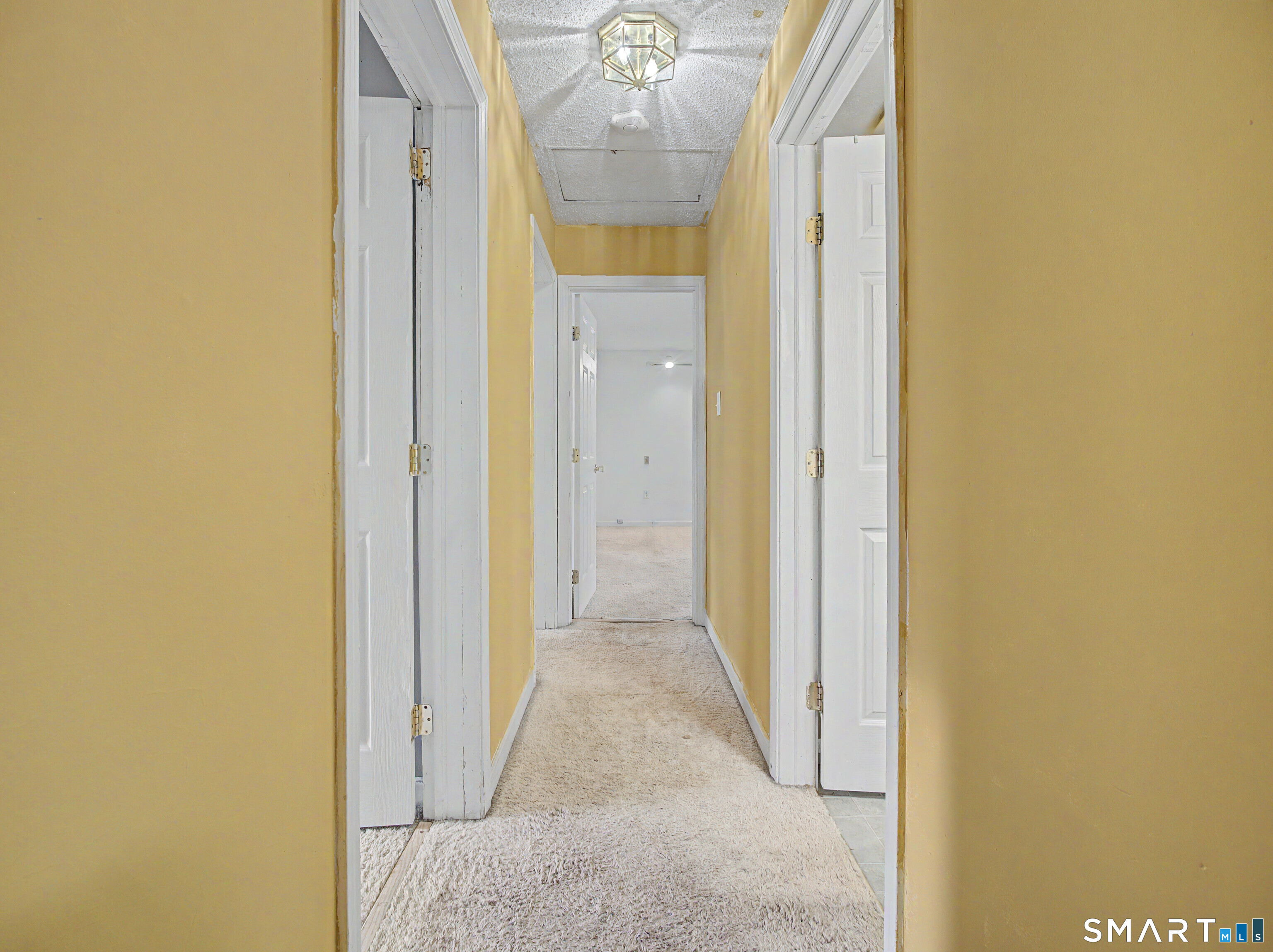134 Roulin Street Torrington, CT 06790 - Photo 9 of 27 a view of a hallway with paintings on the wall