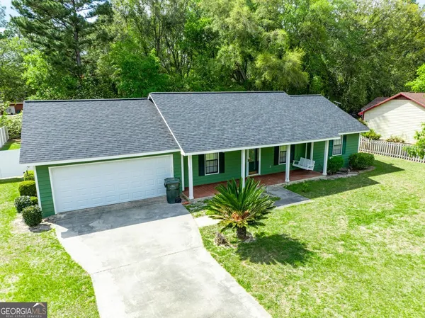 a view of house with garden