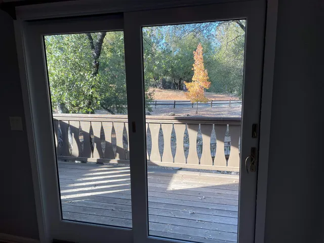 a view of deck door with wooden floor