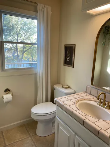 a view of a house with snow on the road