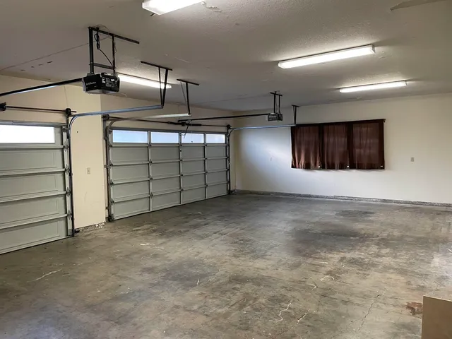 a view of a park with iron fence