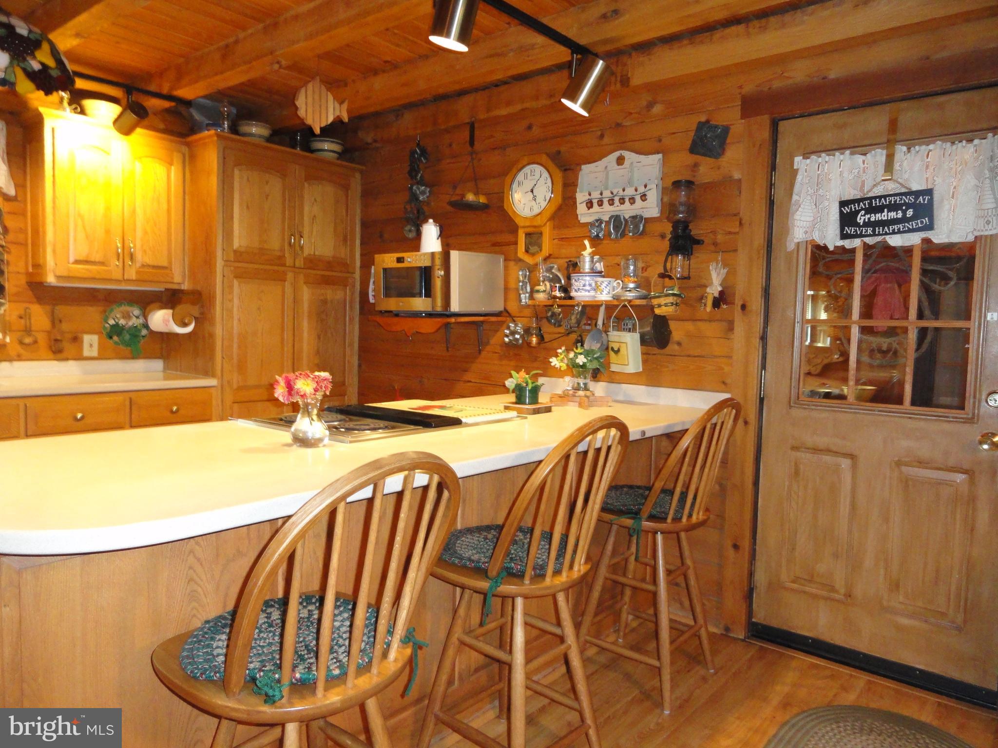 102 Stone Road Barto, PA 19504 - Photo 20 of 49 Kitchen breakfast bar and door to breezeway