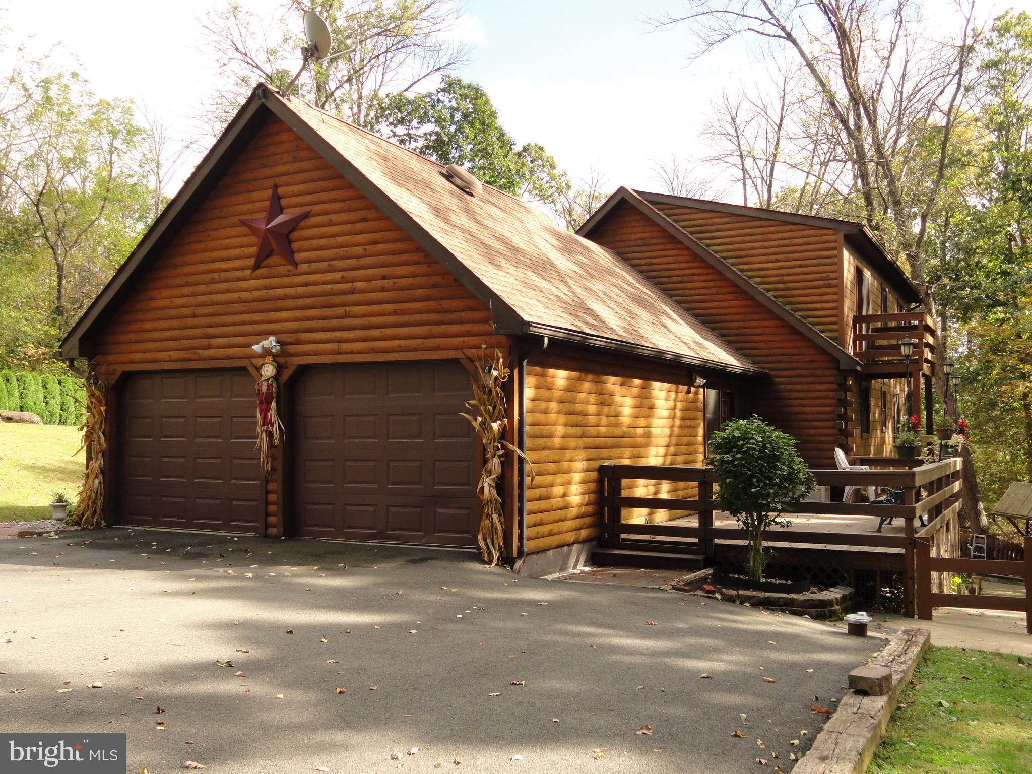 102 Stone Road Barto, PA 19504 - Photo 3 of 49 Right side showing 2 car garage with rear deck.