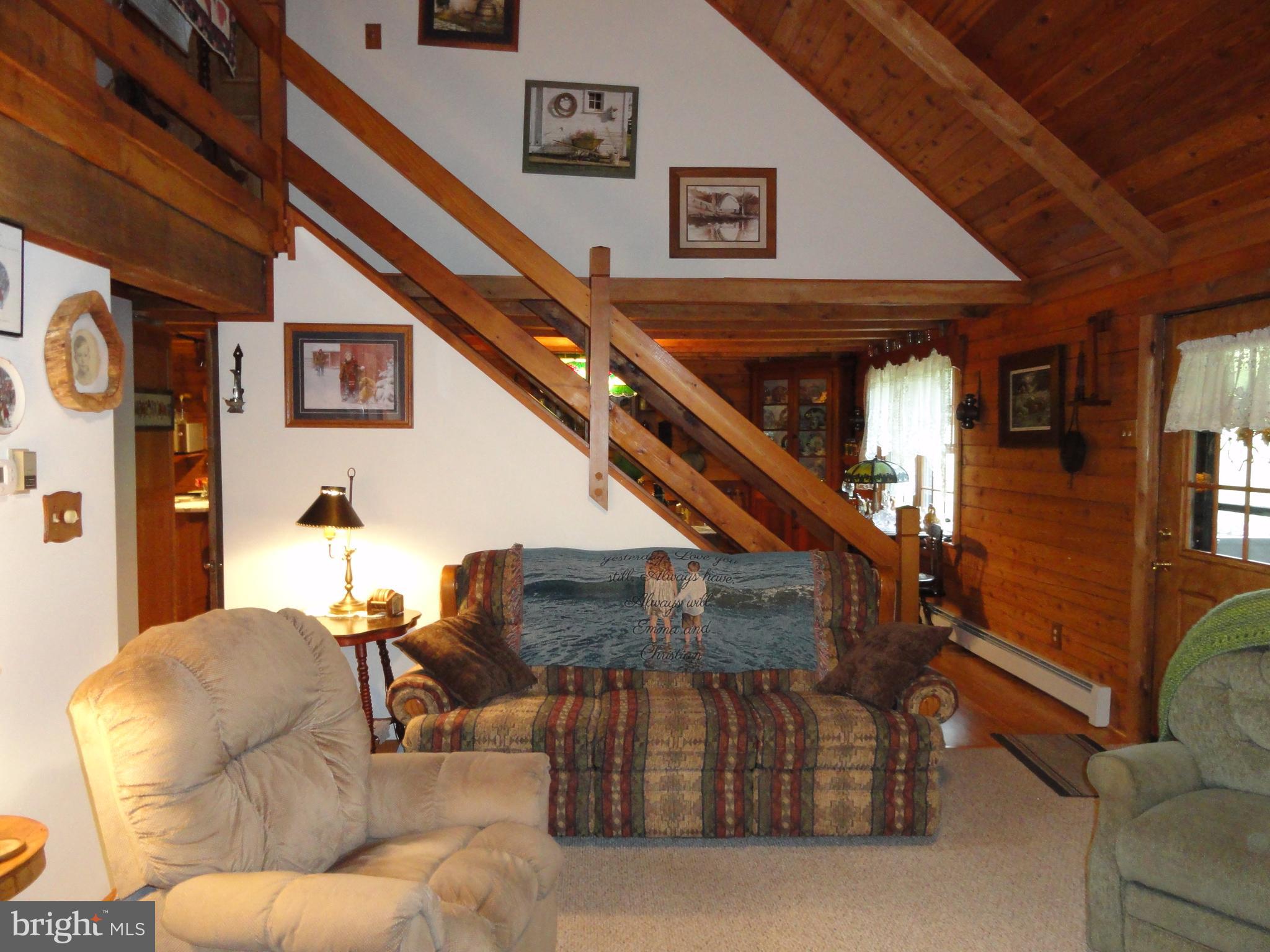 102 Stone Road Barto, PA 19504 - Photo 10 of 49 Living room with view towards staircase and dining