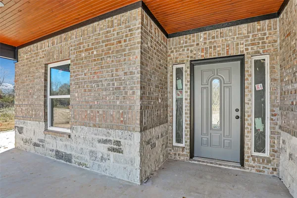 a front view of a house with a glass door