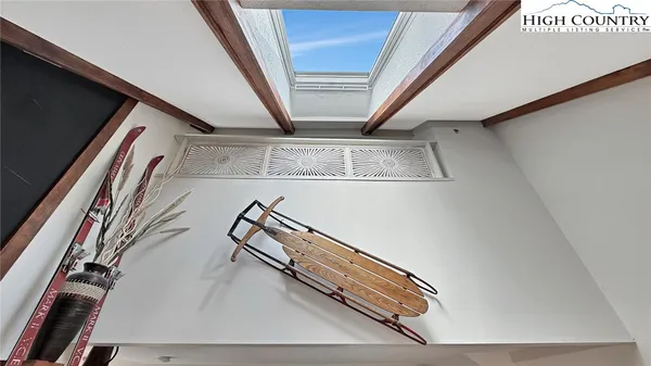 a bathroom with a granite countertop sink mirror and toilet