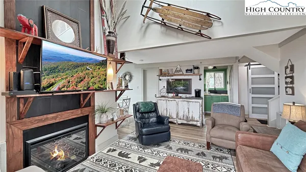 a view of a balcony with chair and wooden floor