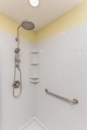 a view of a storage & utility room with windows