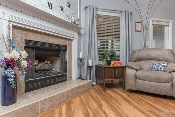 a living room with furniture and a fireplace