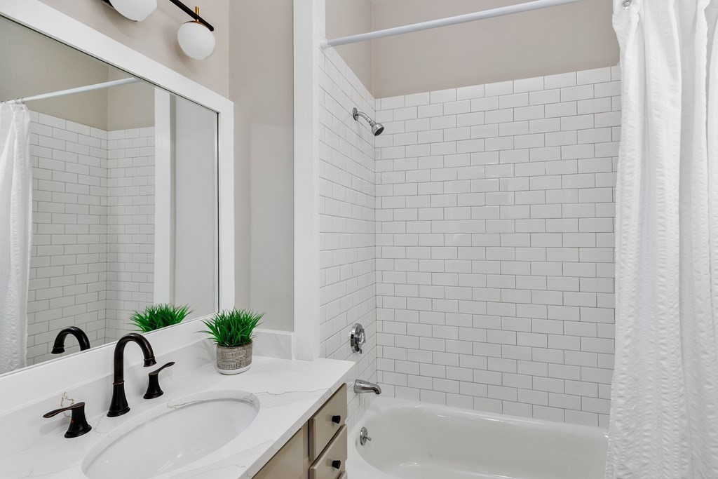 24 Adams Street, Unit 5 Somerville, MA 02145 - Photo 12 of 28 a bathroom with a sink and a bathtub