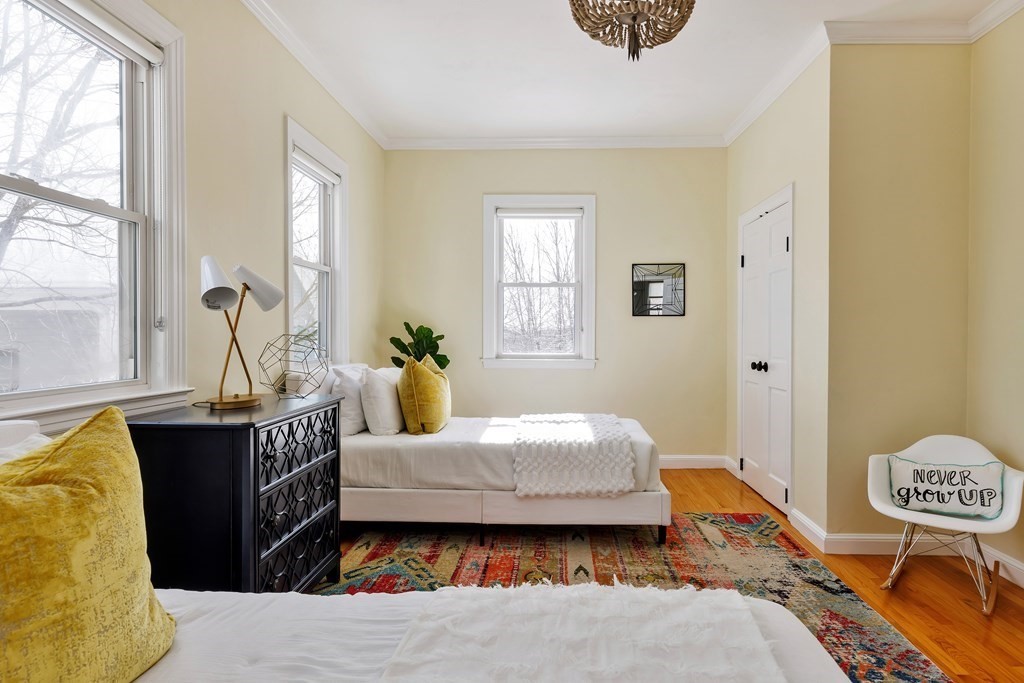 24 Adams Street, Unit 5 Somerville, MA 02145 - Photo 14 of 28 a living room with a bed furniture and a window