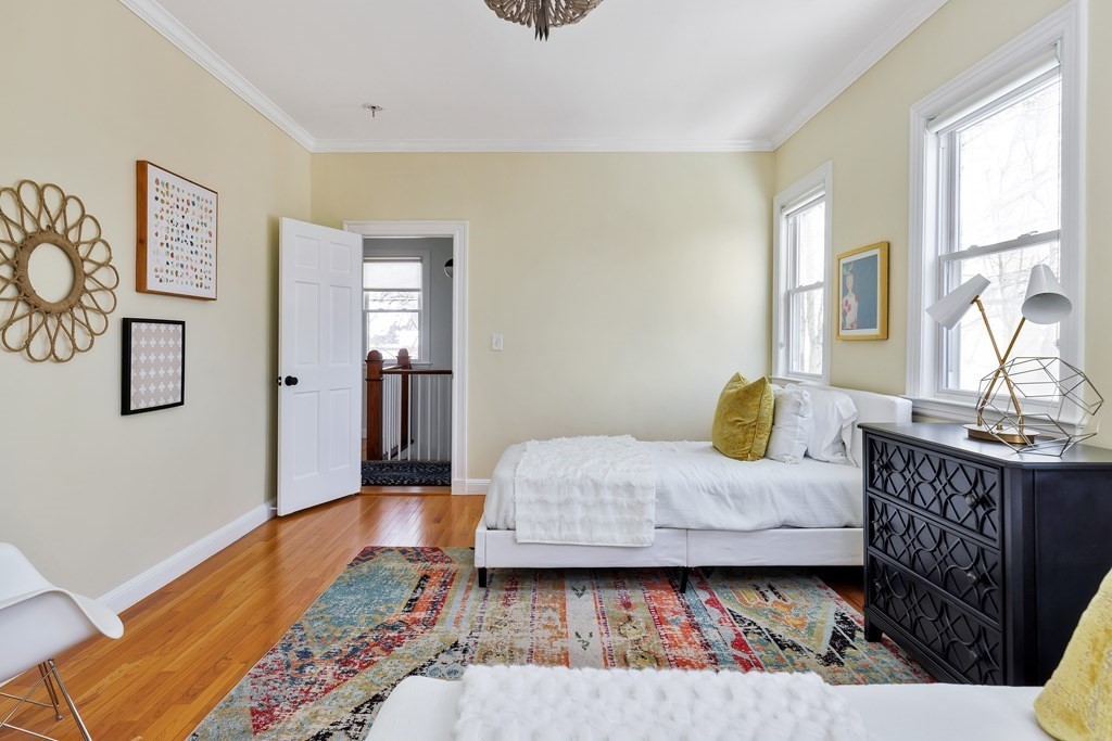 24 Adams Street, Unit 5 Somerville, MA 02145 - Photo 15 of 28 a bedroom with furniture and window