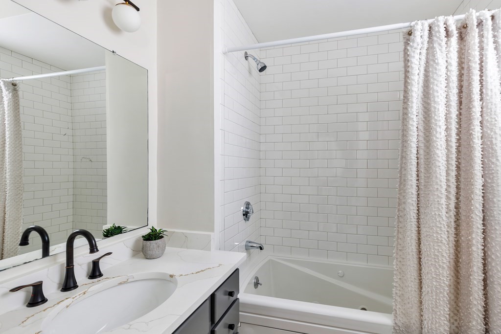 24 Adams Street, Unit 5 Somerville, MA 02145 - Photo 19 of 28 a bathroom with a sink and a mirror