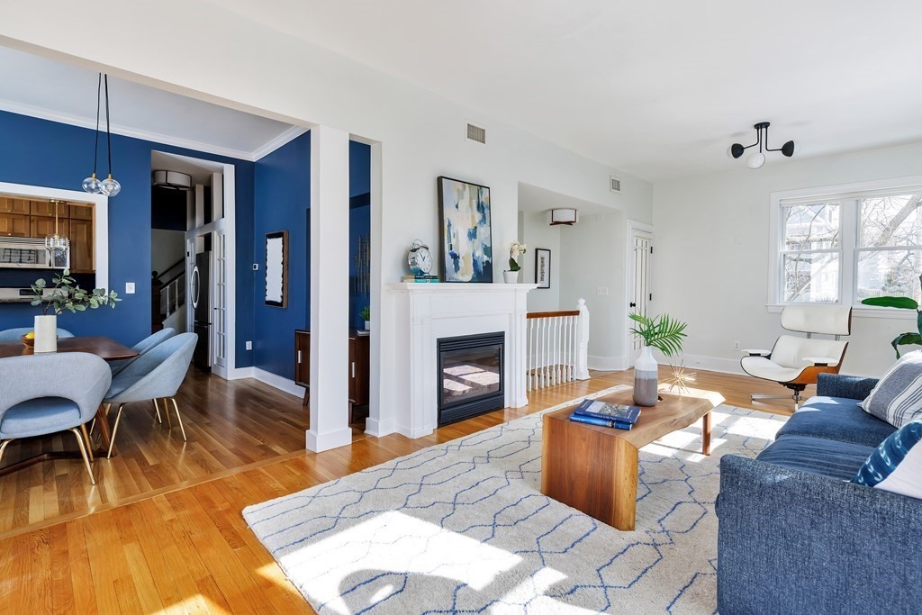 24 Adams Street, Unit 5 Somerville, MA 02145 - Photo 2 of 28 a living room with furniture and a fireplace