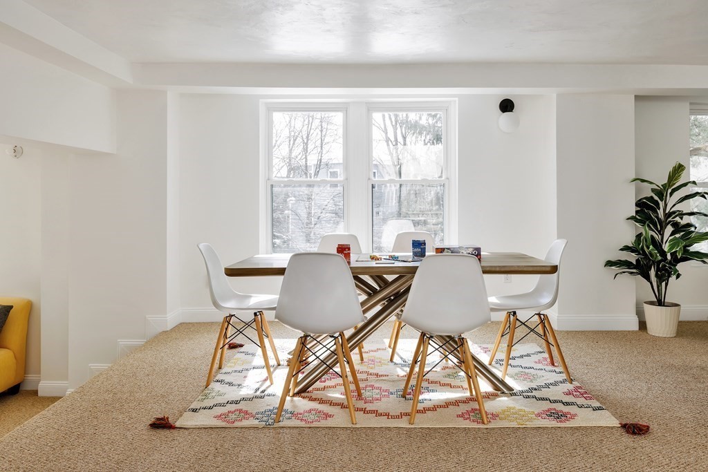 24 Adams Street, Unit 5 Somerville, MA 02145 - Photo 23 of 28 a view of a dining room with furniture window and outside view