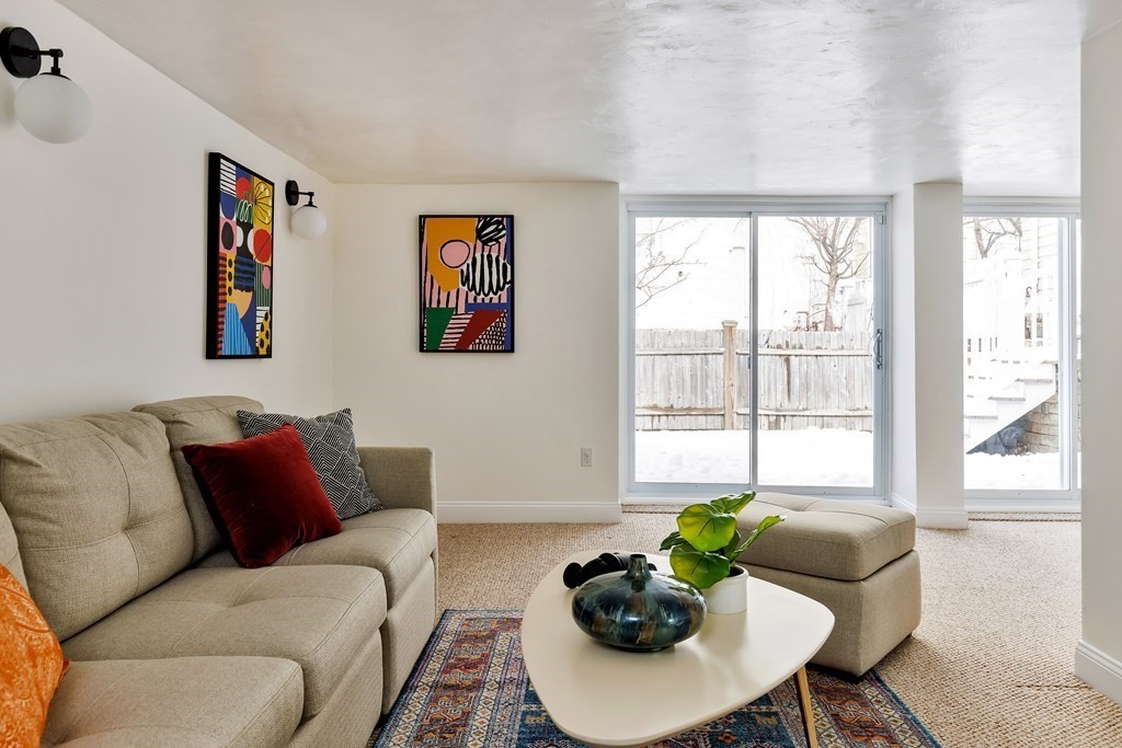 24 Adams Street, Unit 5 Somerville, MA 02145 - Photo 25 of 28 a living room with furniture and a potted plant