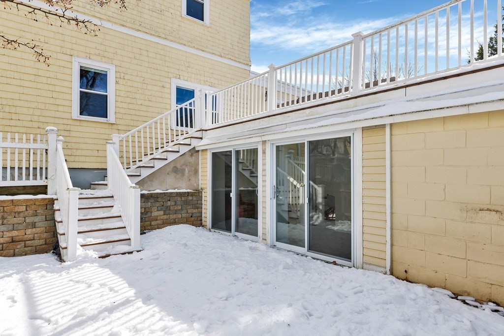 24 Adams Street, Unit 5 Somerville, MA 02145 - Photo 26 of 28 a view of a house with a balcony