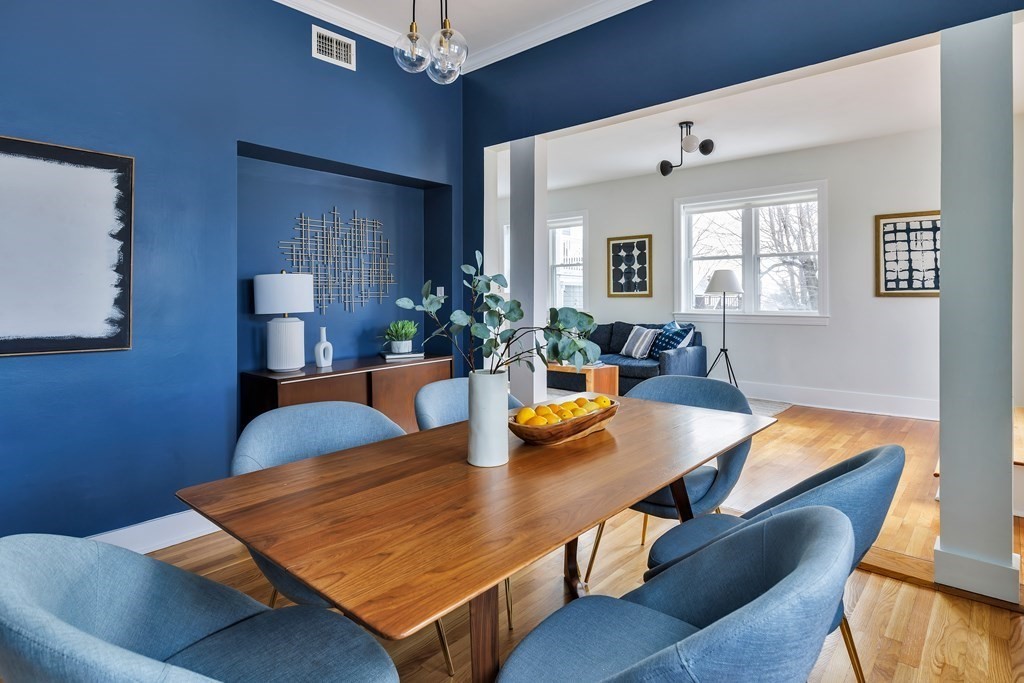 24 Adams Street, Unit 5 Somerville, MA 02145 - Photo 5 of 28 a view of a dining room with furniture and wooden floor