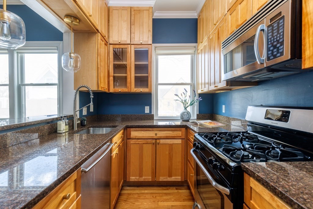 24 Adams Street, Unit 5 Somerville, MA 02145 - Photo 7 of 28 a kitchen that has a stove and a sink