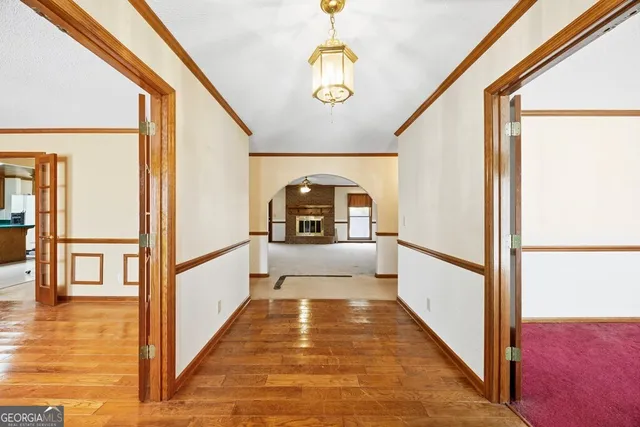 a view of a hallway view with large windows