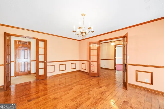a view of an entryway with wooden floor
