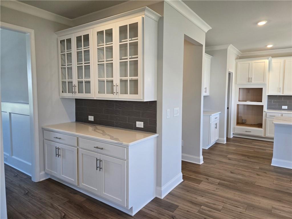 304 Westfall Terrace Loganville, GA 30052 - Photo 13 of 50 a kitchen with a cabinets and wooden floor