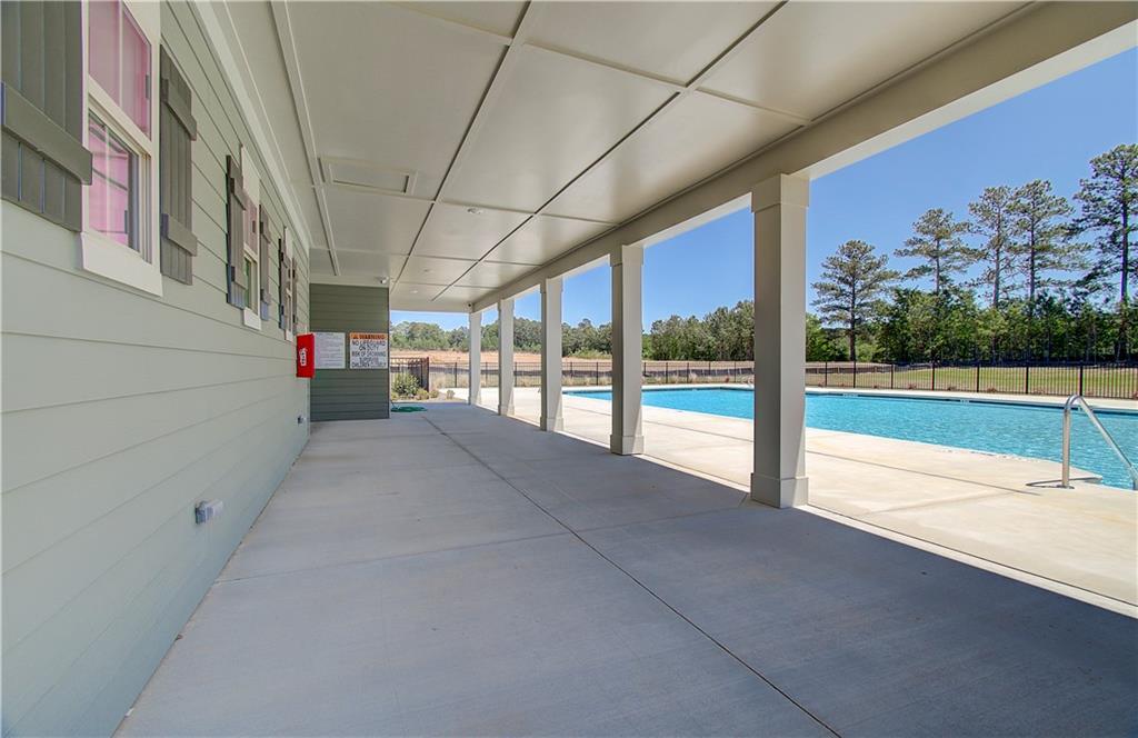 304 Westfall Terrace Loganville, GA 30052 - Photo 46 of 50 a view of a living room hardwood floor and a building