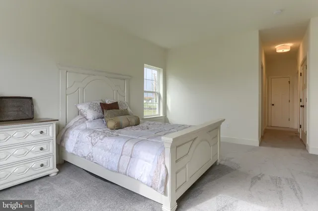 a bedroom with a bed and a tv