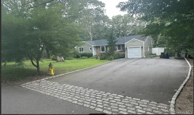 a view of a house with a street