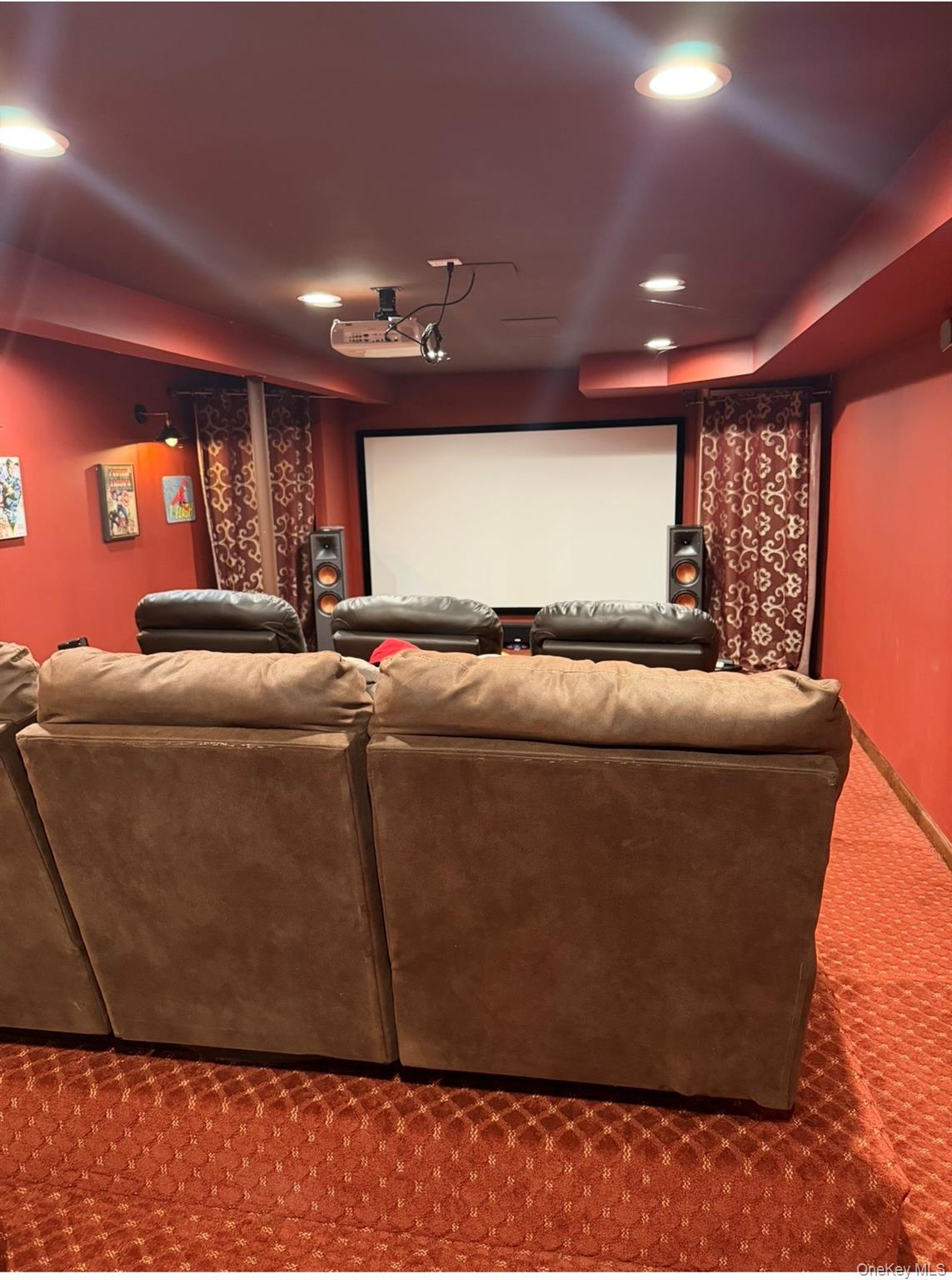 19 New Mill Road Smithtown, NY 11787 - Photo 11 of 13 a room with furniture and a projector screen