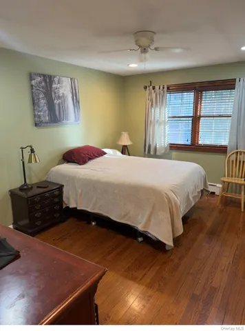 a room with furniture and a projector screen