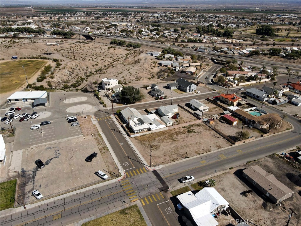 1510 Washington Street Needles, CA 92363 - Photo 12 of 35 an aerial view of multiple houses with outdoor space