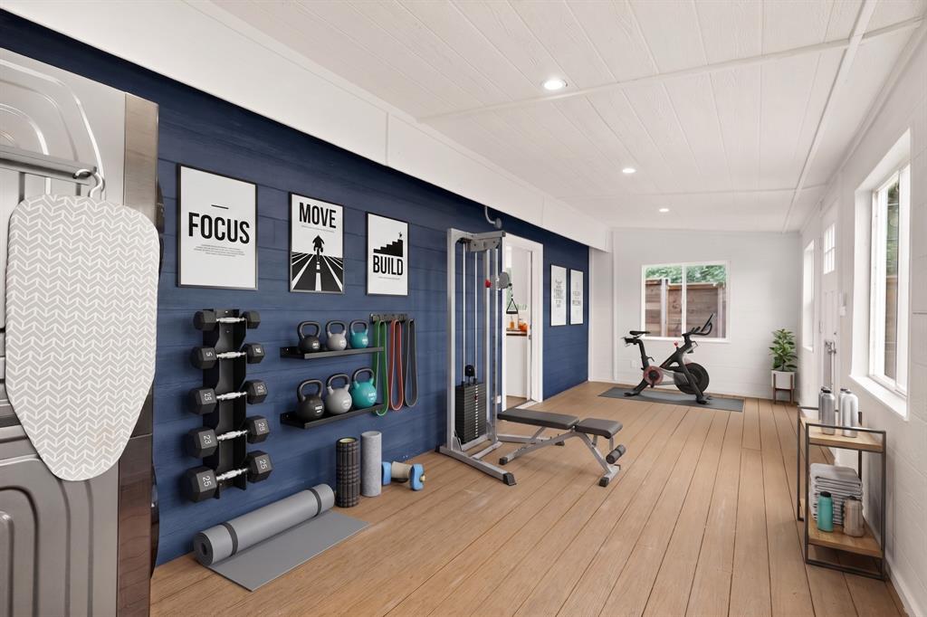 304 East County Line Road Royse City, TX 75189 - Photo 18 of 38 Virtually Staged Dedicated fitness area featuring wide plank wood-finish flooring, recessed lighting, and bright white walls