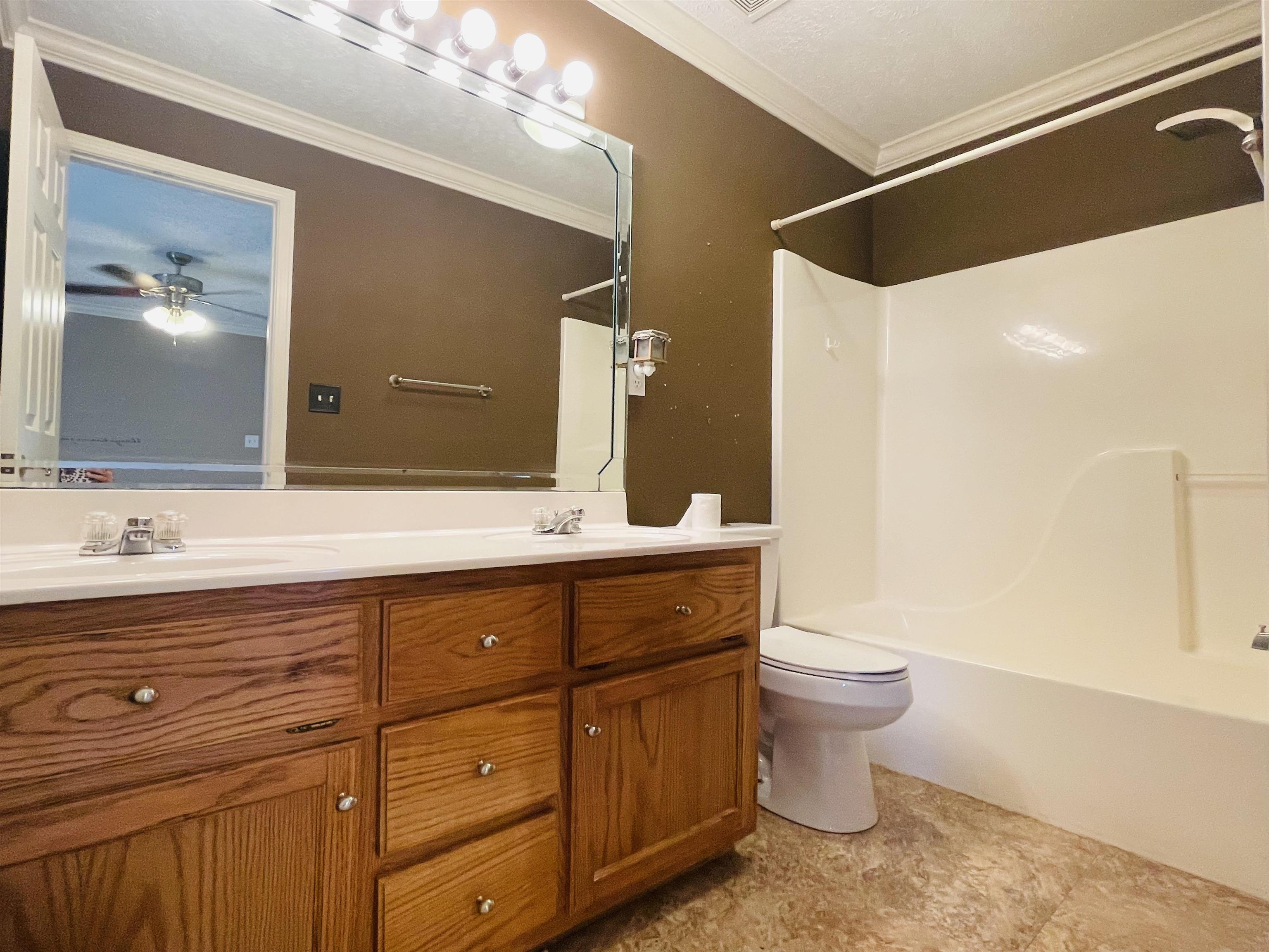 50 Eric Lane West Ramer, TN 38367 - Photo 11 of 19 a bathroom with a double vanity sink a toilet and a mirror