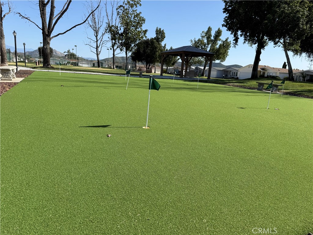 27250 Murrieta Road, Unit 51 Menifee, CA 92586 - Photo 15 of 15 a view of a golf course with a lake