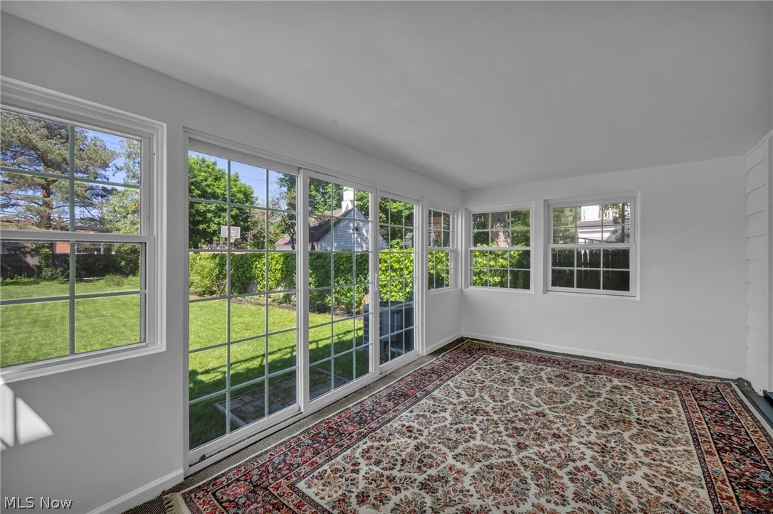 3543 Lytle Road Shaker Heights, OH 44122 - Photo 41 of 49 Sunroom featuring multiple grid-pattern windows and a sliding glass door