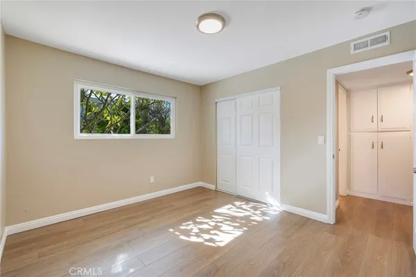 a view of a livingroom with wooden floor and window
