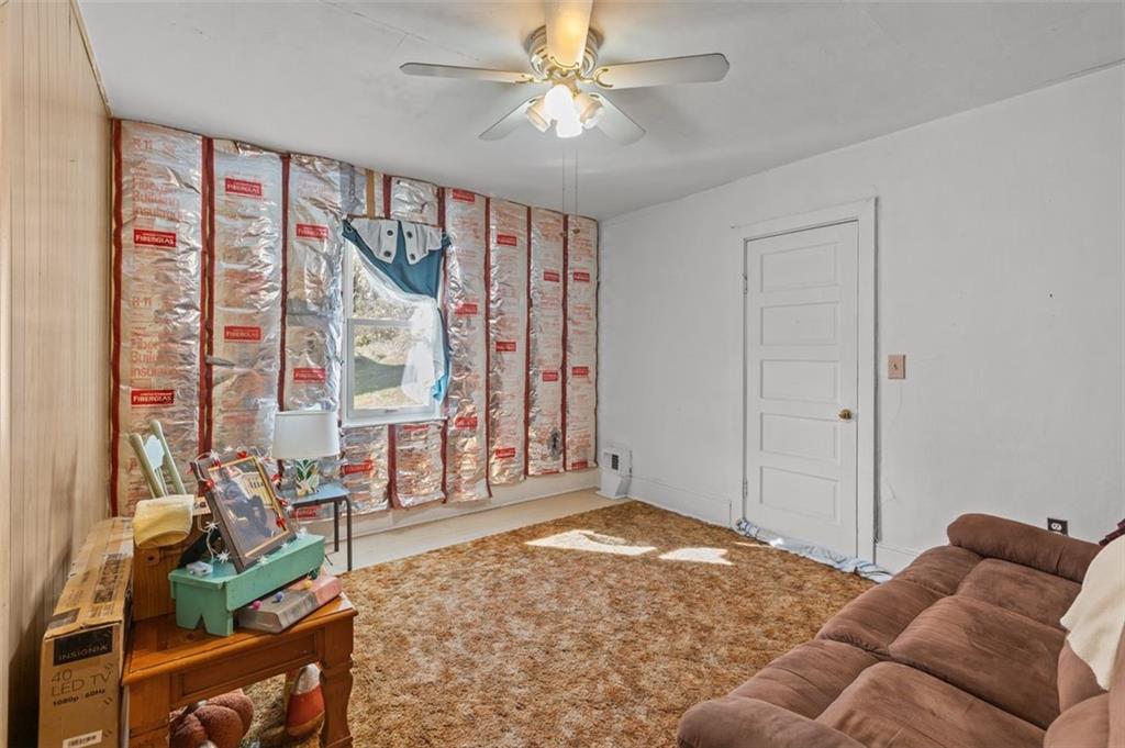 801 Bower Hill Road Bridgeville, PA 15017 - Photo 14 of 34 a living room with furniture and a window