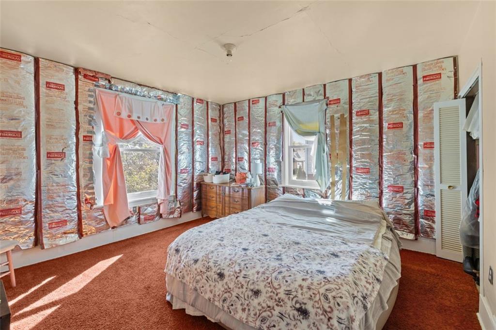 801 Bower Hill Road Bridgeville, PA 15017 - Photo 15 of 34 a bed sitting in a spacious bedroom next to a window