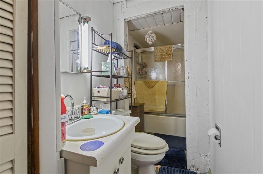 801 Bower Hill Road Bridgeville, PA 15017 - Photo 19 of 34 a bathroom with a sink toilet and shower