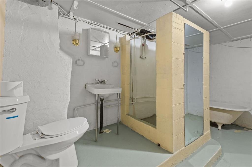 801 Bower Hill Road Bridgeville, PA 15017 - Photo 25 of 34 a bathroom with a shower a toilet and a sink