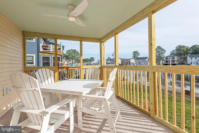 a view of a balcony with lake view and a floor to ceiling window