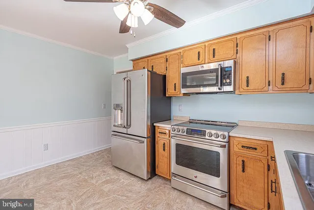 a kitchen with a stove microwave and refrigerator