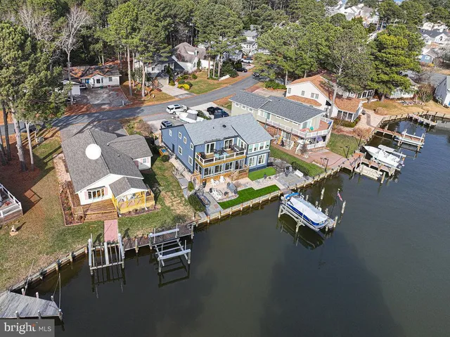 an aerial view of residential houses with outdoor space