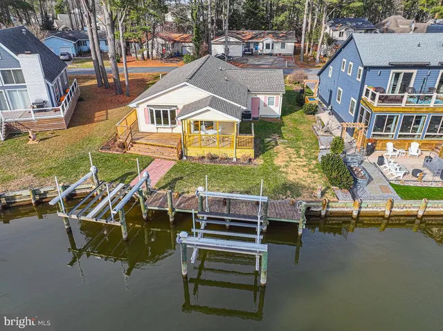 an aerial view of a house with swimming pool