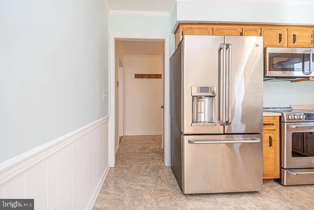 a view of a kitchen with wooden floor